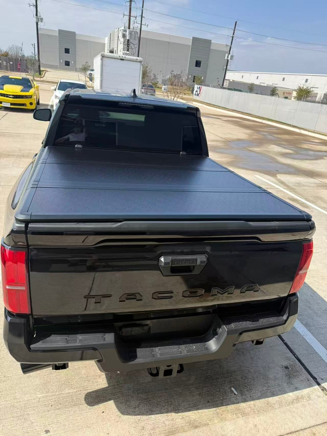 Hard tri-fold tonneau cover fitted to a Toyota Tacoma truck bed